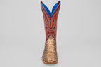 The Barlow - Taupe - Square Toe men’s statement boot features a textured taupe python leather lower, a vibrant red upper with blue and yellow stitching, and is displayed front-facing against a plain gray background.