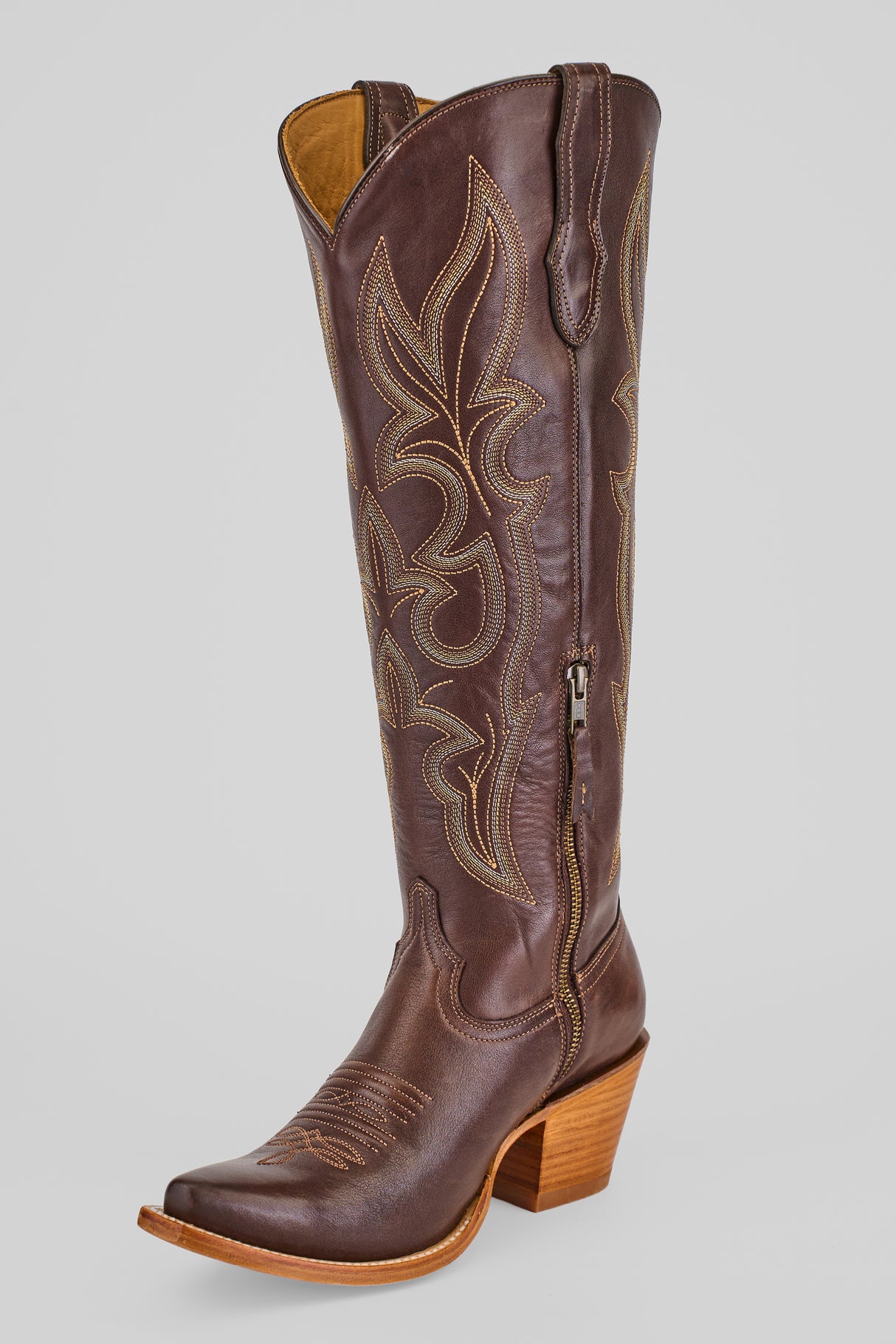 The Allison Dark Moka - Tall Shaft - Snip Toe women's boot features dark mocha leather, decorative tan stitching, a snip toe, side zipper, and stacked wooden heel, shown on a plain gray background.