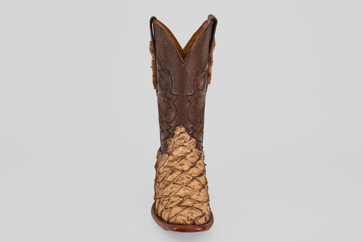 The Conor - Matte Orix - Narrow Square Toe features a single cowboy boot with textured tan Pirarucu leather in a matte finish and a dark brown, intricately stitched upper, shown on a plain light gray background.
