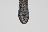 Close-up of the Conor - Charcoal - Roper Toe boot's textured, dark charcoal toe with a square pattern, possibly crafted from exotic fish leather, shown against a plain light gray background.