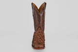 The Conor - Brown - Rodeo Toe boot is shown from the front against a plain white background, featuring detailed stitching on the shaft and a textured, patterned foot.