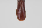 A close-up, top-down view of the toe of the Blaze – Brown – Square Toe boot showcases lizard-textured leather and decorative stitching, highlighting the rugged elegance of this classic western style.