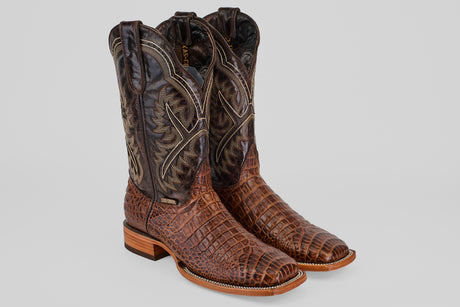 The Caiman Belly Choco - Embossed Leather - Square Toe (E423) boots feature brown, square toes, a textured caiman-like pattern on the foot, and intricate stitching on dark brown embossed leather shafts.