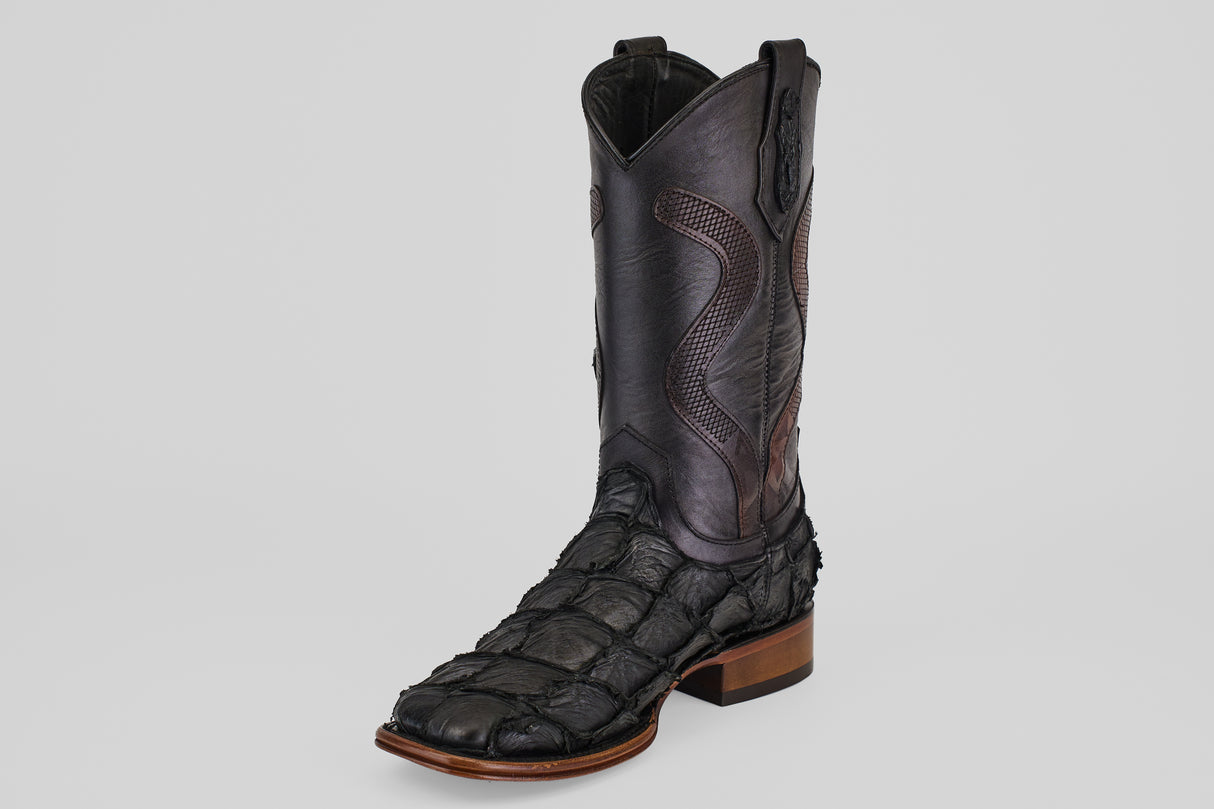 The Conor Platinum - Matte Black - Square Toe (Diamond) boot features a single black design with detailed stitching, an exotic pirarucu-like texture, a brown sole, and is set against a plain light gray background.