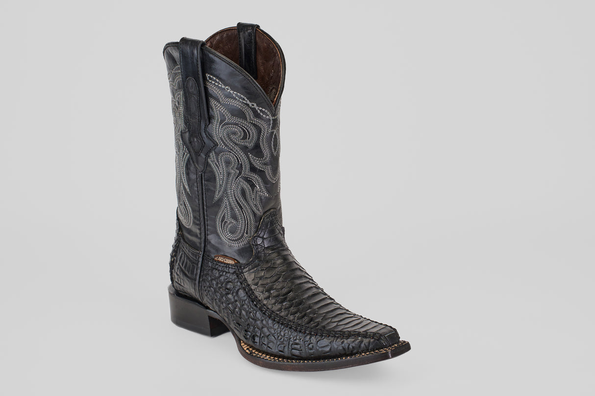 A single Python Black - Embossed Leather - Versy Toe (E202) boot with intricate silver stitching, textured foot, square toe, low heel, and dual pull tabs is displayed on a light gray background.