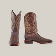 The Cheyenne Chocolate - Square Toe cowboy boots, crafted from premium cowhide with intricate stitching, are displayed on a white background. One boot stands upright showing the side view, while the other highlights its square toe from the front.