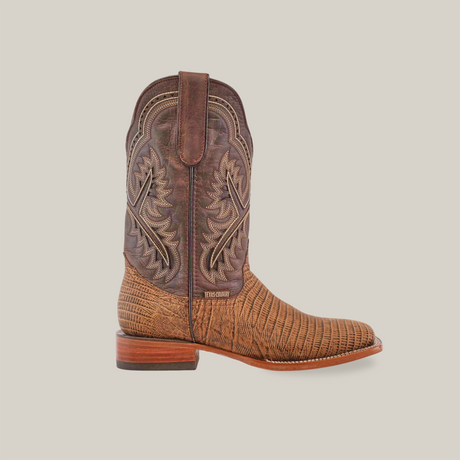 A single Lizard Print Tabaco cowboy boot with intricate stitching on a white background, featuring a handmade design, slightly pointed toe, lizard print textured lower section, and wooden heel.