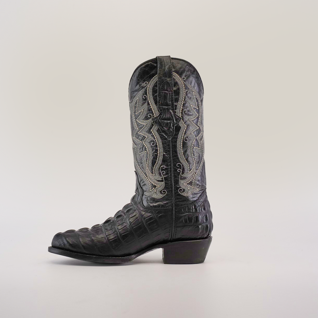 The Crocodile Tail Print Black boot boasts a round toe, intricate gray embroidery on the shaft, and textured cowhide leather reminiscent of crocodile tail print, showcased in soft lighting against a white background.