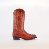 A Crocodile Tail Print Cogñac - Round Toe cowboy boot crafted from brown cowhide leather with intricate shaft stitching on a plain white background.