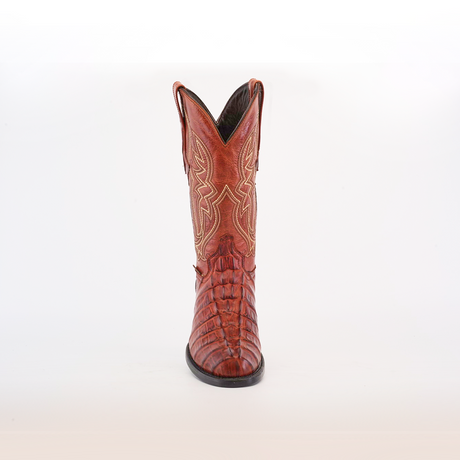 A single Crocodile Tail Print Cogñac boot is displayed against a white background, featuring intricate stitching, a round toe, decorative patterns along the shaft, and a premium leather sole for comfort and durability.