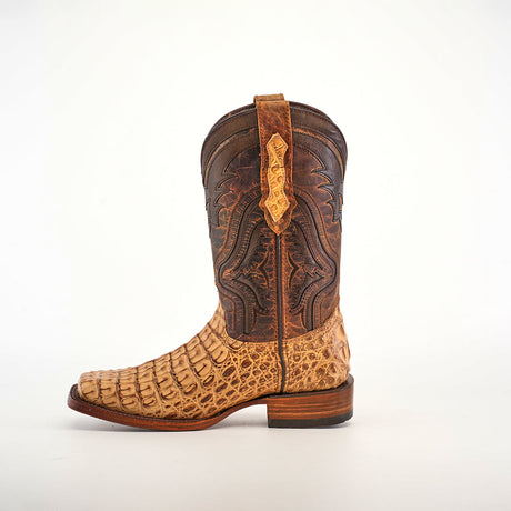 The Exotic Caiman Hornback - Antique - Rodeo Toe cowboy boot features genuine caiman leather with an intricate pattern in light tan and dark brown. It highlights a caiman hornback design on the lower and smooth leather upper, all set against a plain white background.