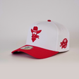 The De Rancho Cap Red is a white and red baseball cap featuring a cartoon cowboy logo on the front, a vibrant red brim, embroidered ranch-themed designs, and a baseball-themed side patch, making it an eye-catching wardrobe addition.