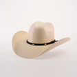 The 1000X Chihuahua Straw Hat is a durable beige cowboy hat with a wide brim, featuring a black band with silver buttons. Crafted from premium materials, it makes a bold fashion statement against the plain white background.