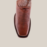 Top view of the Grisly Brown - Rodeo Toe leather boot, featuring a square toe design and decorative stitching. The premium cowhide boot has a textured surface with a lighter patterned upper section, all set against a white background.