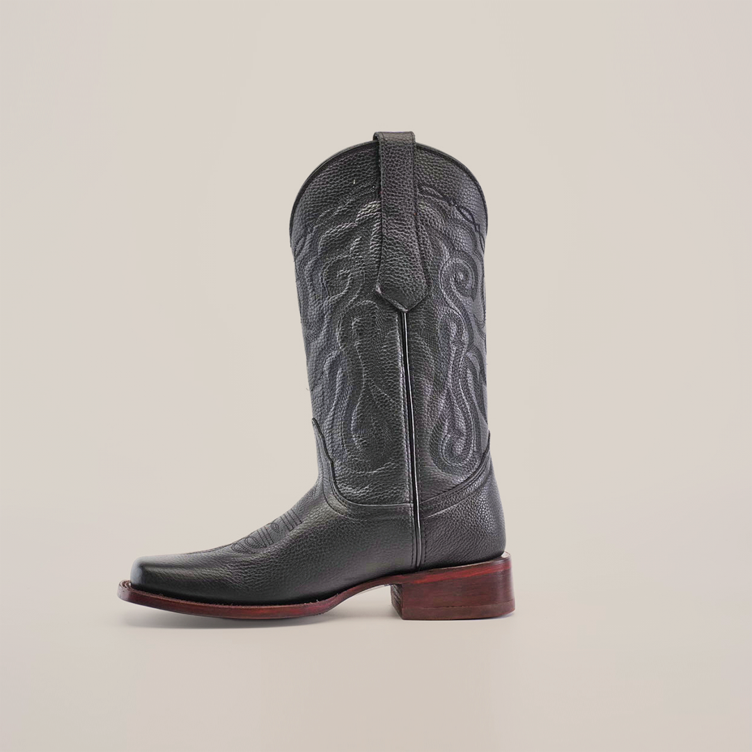 Displayed against a plain white background, the Grisly Black - Rodeo Toe cowboy boot showcases premium cowhide leather with intricate embroidery, a slightly pointed toe, and a brown wooden heel, embodying exquisite craftsmanship.