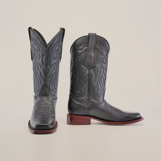 Grisly Black - Rodeo Toe cowboy boots in premium cowhide leather with decorative shaft stitching, a pointed toe, and wooden heels. The boots are pictured on a white background, with one upright and the other angled to show the side view.