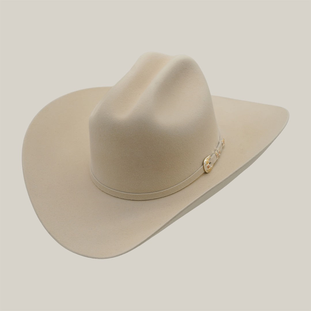 #color_belly
 The Rodeo Special Offer Online: Tony Lama 1000X cowboy hat, in beige with a wide brim and creased crown, has a decorative band set against a plain light background, making it a true fashion masterpiece.