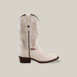 The Exotic Full Quilt Ostrich boot in white features detailed embroidery on genuine ostrich leather. This handmade boot includes a round toe, mid-calf height, brown stitching on a beige background, and a dark brown wooden heel.