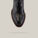 Top view of the Exotic Python - Black - Round Toe shoe, featuring a dark brown sole. The intricately textured leather closely mimics cowboy-favored python boots for their unique style, set against a plain background.