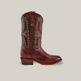 The Exotic Lizard - Brown boots showcase intricate stitching and a smooth texture, highlighted by a decorative red tag. Designed with a lower heel and round toe, they stand confidently against a plain background.