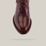 The Exotic Lizard - Brown features a polished leather design with a lizard-like pattern on a light gray background, emphasizing its round toe.