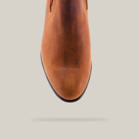 Close-up of the Avejentado Honey boot with a round toe and black sole on a white background.