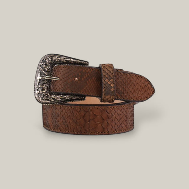 The Exotic Full Quilt Python - Texas Buckle - Matte Brown Belt showcases a Texas-style buckle with intricate detailing on a textured brown leather surface, coiled elegantly on a light background, capturing the essence of Western accessories.