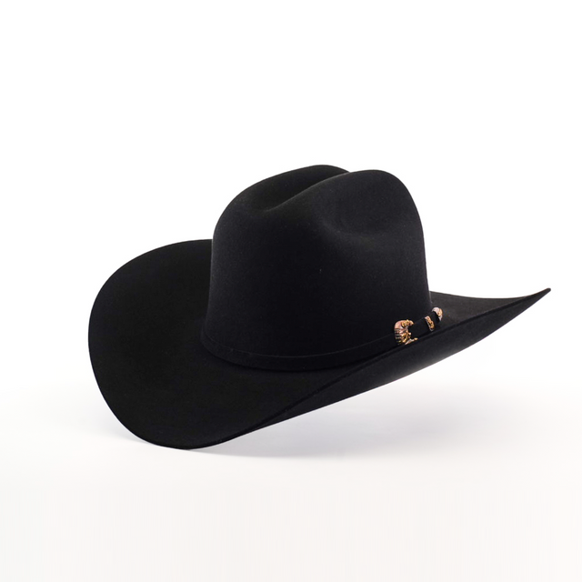 The 1000X Imperial Black by Larry Mahan is a black cowboy hat with a wide brim and slightly curved crown. It features a decorative band with small metal accents on one side, beautifully highlighted against a plain white background.