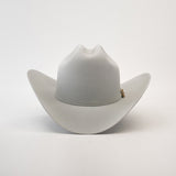 The 1000X Imperial Platinum, a light gray Western hat with a wide brim and subtle band, is reminiscent of the Larry Mahan collection. It is elegantly displayed against a plain white background.