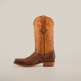 cowboy boot made from rich cowhide leather, showcasing intricate stitching and a sturdy heel, set against a plain white background.