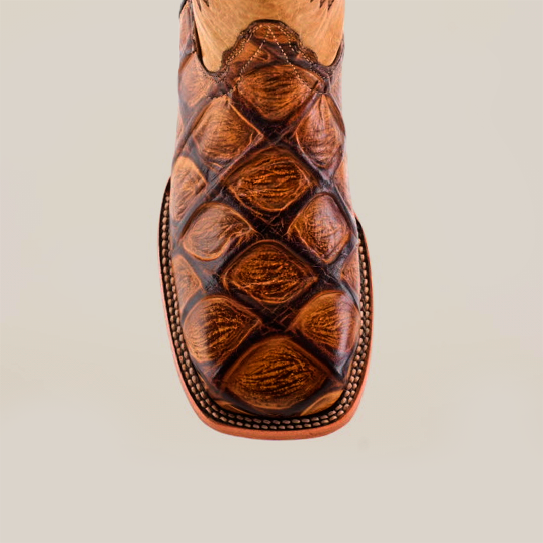 Overhead view of the Big Bass Pirarucu Print Orix - Square Toe boot, crafted from premium cowhide leather with textured brown finish and intricate stitching, against a plain background.