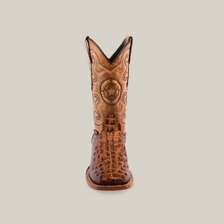 The Morelet Crocodile Print Orix - Square Toe cowboy boot is made from premium cowhide, featuring intricate brown leather detailing and a star emblem on the shaft, all against a plain white background for an elegant finish.