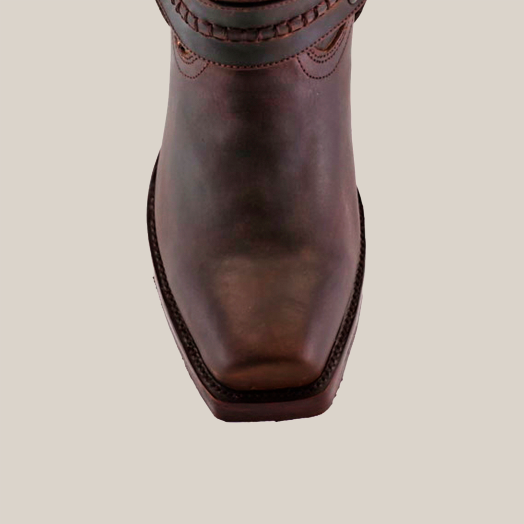 An Azkar Tan boot is showcased on a white background, displaying intricate stitching, a decorative ankle strap, and a slip-resistant sole for safety.