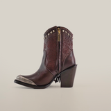 Presenting the Dallas Fringe Bootie Chocolate J Toe: a dark brown cowboy boot with floral designs, a metallic toe cap, and studs at the top. From our Platinum Collection, it includes a block heel, side zipper, and fringe detail. Displayed on a plain white background.