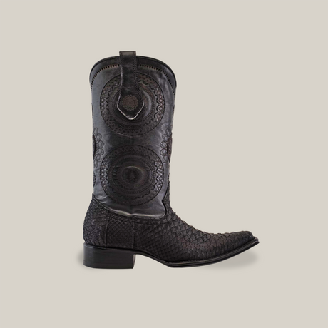 Part of our Platinum Collection, the Exotic Python boot in Matte Black features intricate circular embroidery and a textured python leather pattern. It has a Versy toe and sturdy heel, all set against a plain white background.