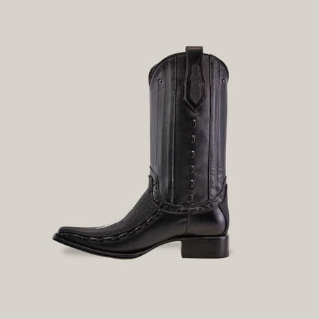 The Exotic Stingray - Platinum - Black cowboy boot with a Versy Toe is crafted from luxurious stingray leather. It features a textured upper, pointed toe, medium-height heel, and decorative stitching on the shaft, epitomizing elite cowboy fashion against a plain white background.