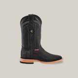 A single Exotic Python - Matte Black cowboy boot with a textured python surface, red and white label, and decorative emblem near the top. It features a square toe with a light brown sole and heel, displayed on a beige background.