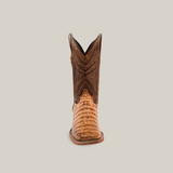 The Exotic Caiman Belly - Antique - Square Toe boot features a textured tan foot and dark brown shaft with intricate patterns, embodying classic cowboy fashion. The unique touch of exotic caiman belly leather stands out against a plain background.