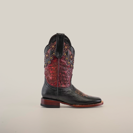 The Grecas Black - Short Shaft - Square Toe boot stands upright, exhibiting its exquisite craftsmanship with a black leather foot, red embossed upper with floral embroidery, brown stitching, and a wooden heel set against a plain white background.