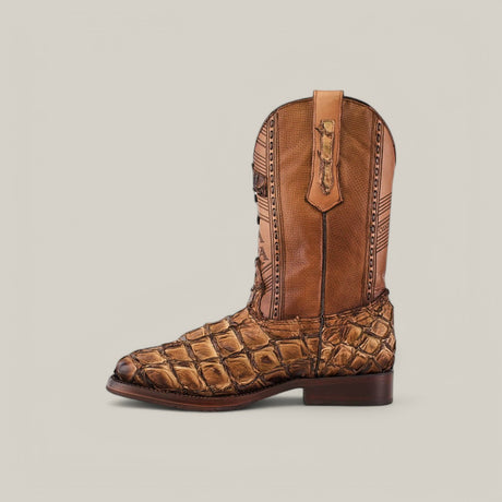 The Asturias Honey Fish Pirarucu Laser & Woven boot (CU658) features a side view with tan and brown crocodile skin texture, intricate stitching, a dark brown sole, a high shaft with woven design pull strap, all beautifully showcased against a plain light gray background.