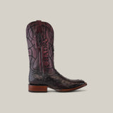 A single brown Blackcherry Ostrich boot, featuring Clyde, boasts a decorative shaft design with laser engraving and embroidery, crafted from exotic leather with a leather sole. The image is set against a plain beige background.