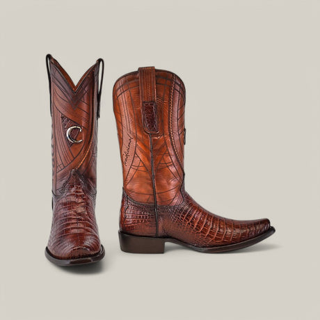 The Brown Moreletii Laser & Embroidery boots (CU700) feature rich brown alligator leather, with one boot upright and the other angled to showcase detailed patterns, stitching, and laser-engraved accents against a light gray background.