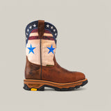 The Aventajado Penac Soft Toe - E6282 is a brown cowboy boot with a leather texture, featuring a patriotic-themed upper. It has a shaft with white fabric and blue stars, and a dark blue top with white stars and red stripes. These boots are known for their durability and rugged black-and-brown sole.