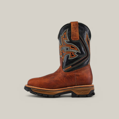 The Amazonas Honey Composite Toe - E6002 boot flaunts a brown and black design with intricate orange and gray stitching. It features a thick sole with rugged tread, a pull tab, and is set against a plain light gray backdrop. Perfect for tackling any terrain.