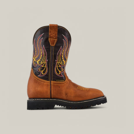 The Golden Ateus Composite Toe - E6016 boot embodies Texas Country Work Boots charm with its brown lower and black upper. It features yellow and red flame-like embroidery on the shaft, a pull tab, and a durable black rubber sole with visible stitching, set against a plain gray background.