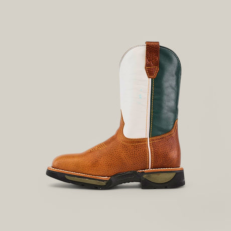 The Rino Honey Soft Toe - E6077 is a Texas Country Work Boot with a brown textured foot, white and dark green shaft, pull straps, and a chunky sole. Renowned for its durability on rugged terrains, its displayed against a plain background.