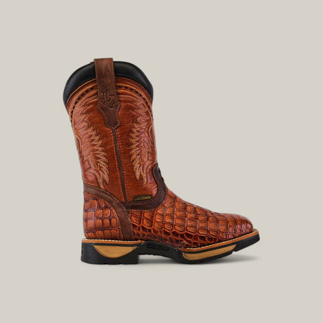 The Alligator Print Cogñac Soft Toe - E6022 cowboy boot showcases a rich brown color with an alligator-style pattern, intricate stitching on the upper shaft, and a black heel and sole against a light beige background, combining style with durability.