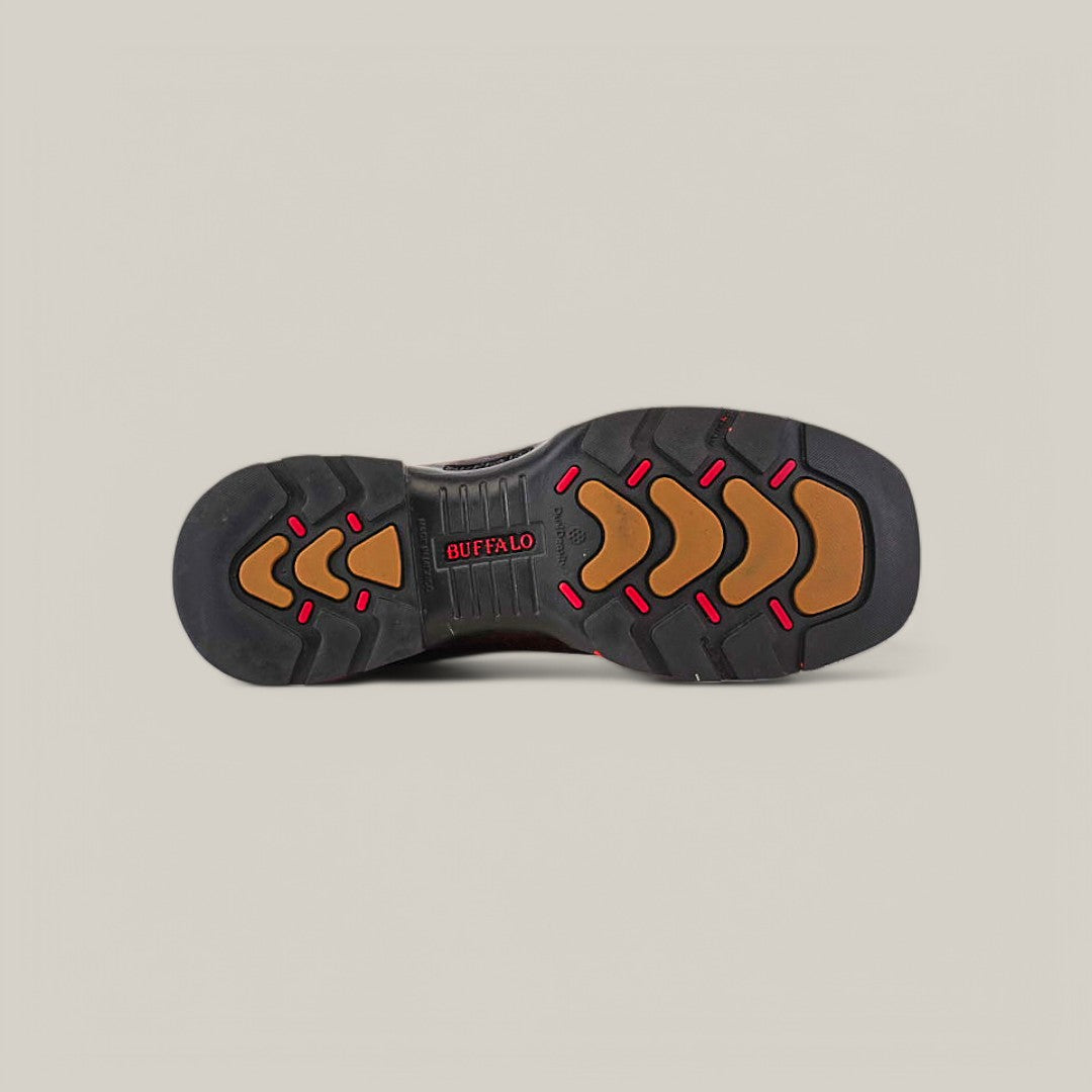 Close-up view of the Crazy Black Composite Toe - E6185s black sole with red and tan accents, showcasing a textured pattern for durability. BUFFALO appears in red on the sole against a plain beige background.