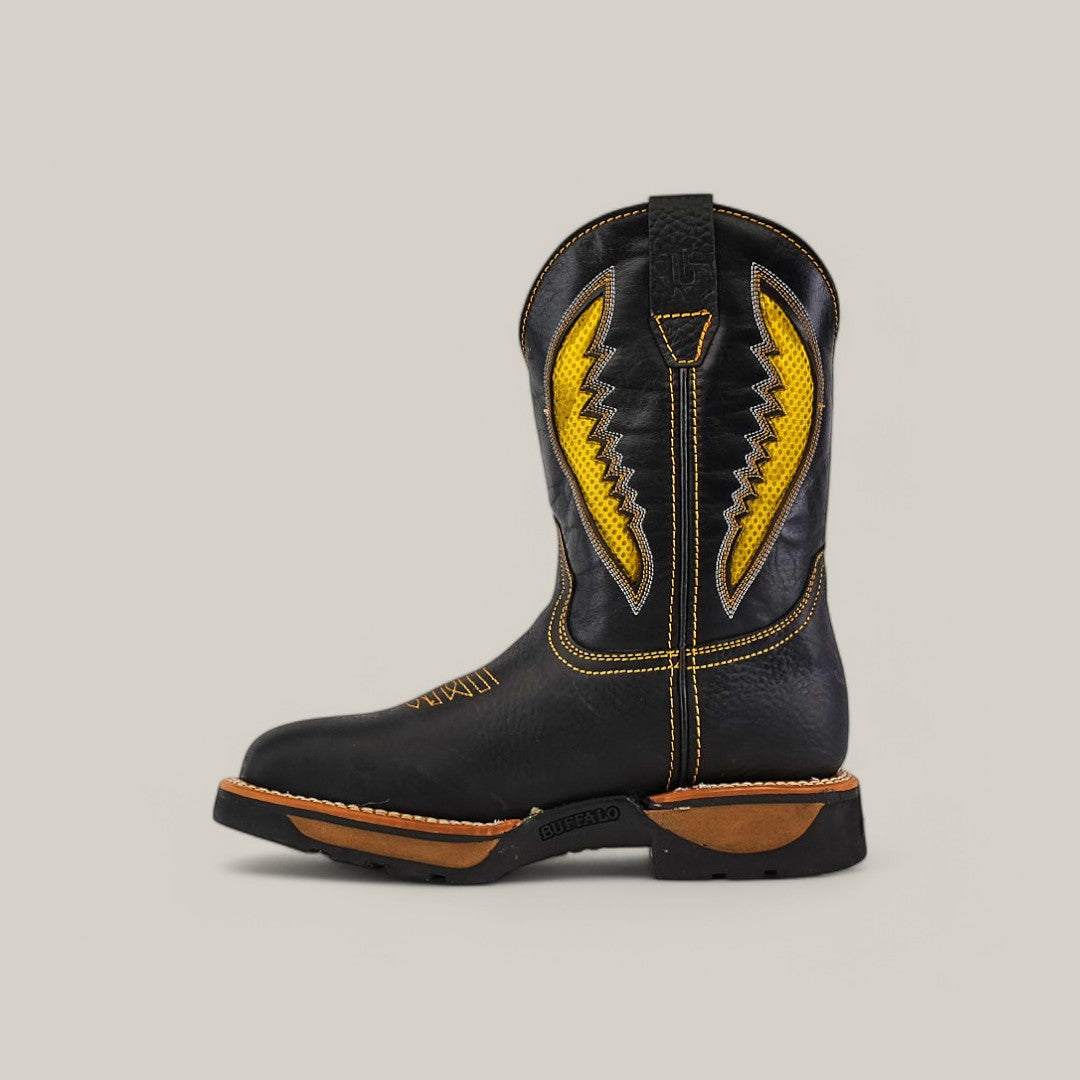 The Rhino Black Soft Toe - E6087 is a black waterproof Texas Country Work Boot with yellow zigzag stitching, brown soles, and a top loop for easy pull-on, ensuring durability and comfort for any adventure.