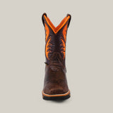 The Jurasic Brown Soft Toe - E6089 boot features a textured brown leather foot with an orange and brown stitched shaft. Highlighting the durability expected from quality work boots, it is viewed front-on against a plain backdrop.